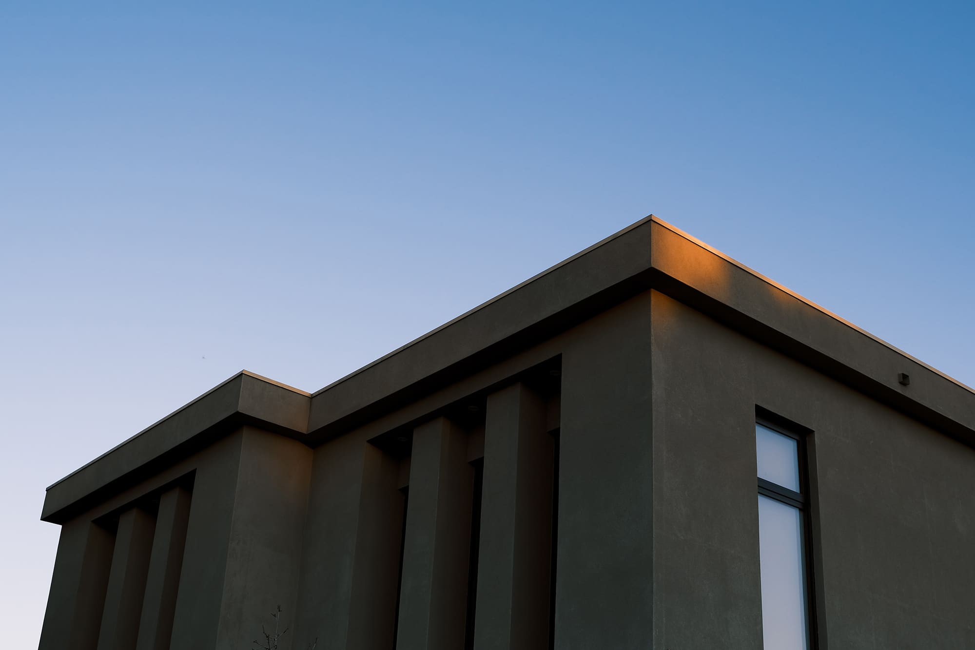 White concrete building under blue sky during daytime