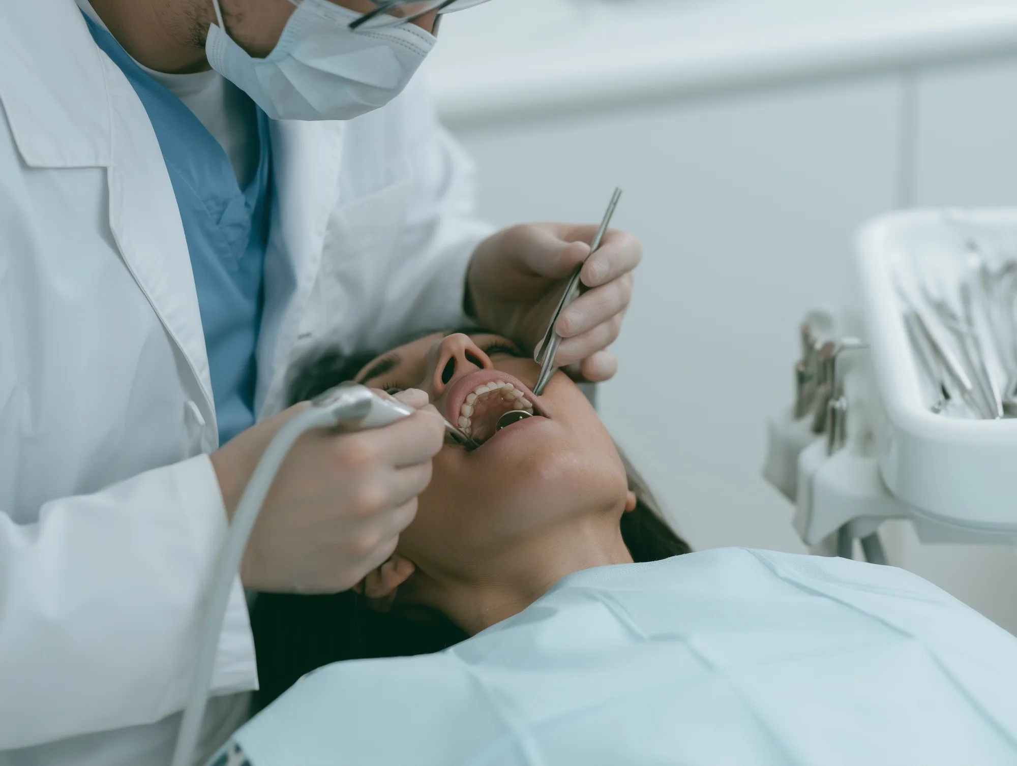 A dentist examining a patient's teeth